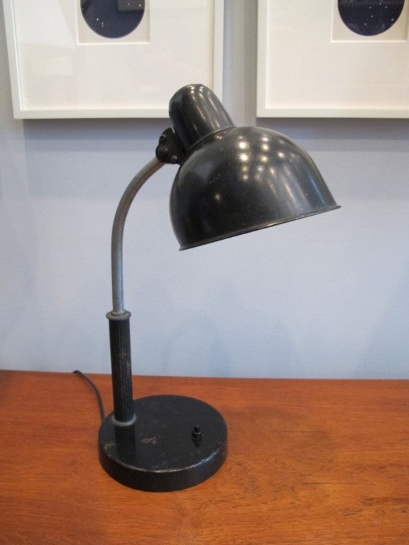 Black painted and chrome plated steel desk lamp designed by Christian Dell for Kaiser & Company. The height is slightly variable but the lamp is about 17