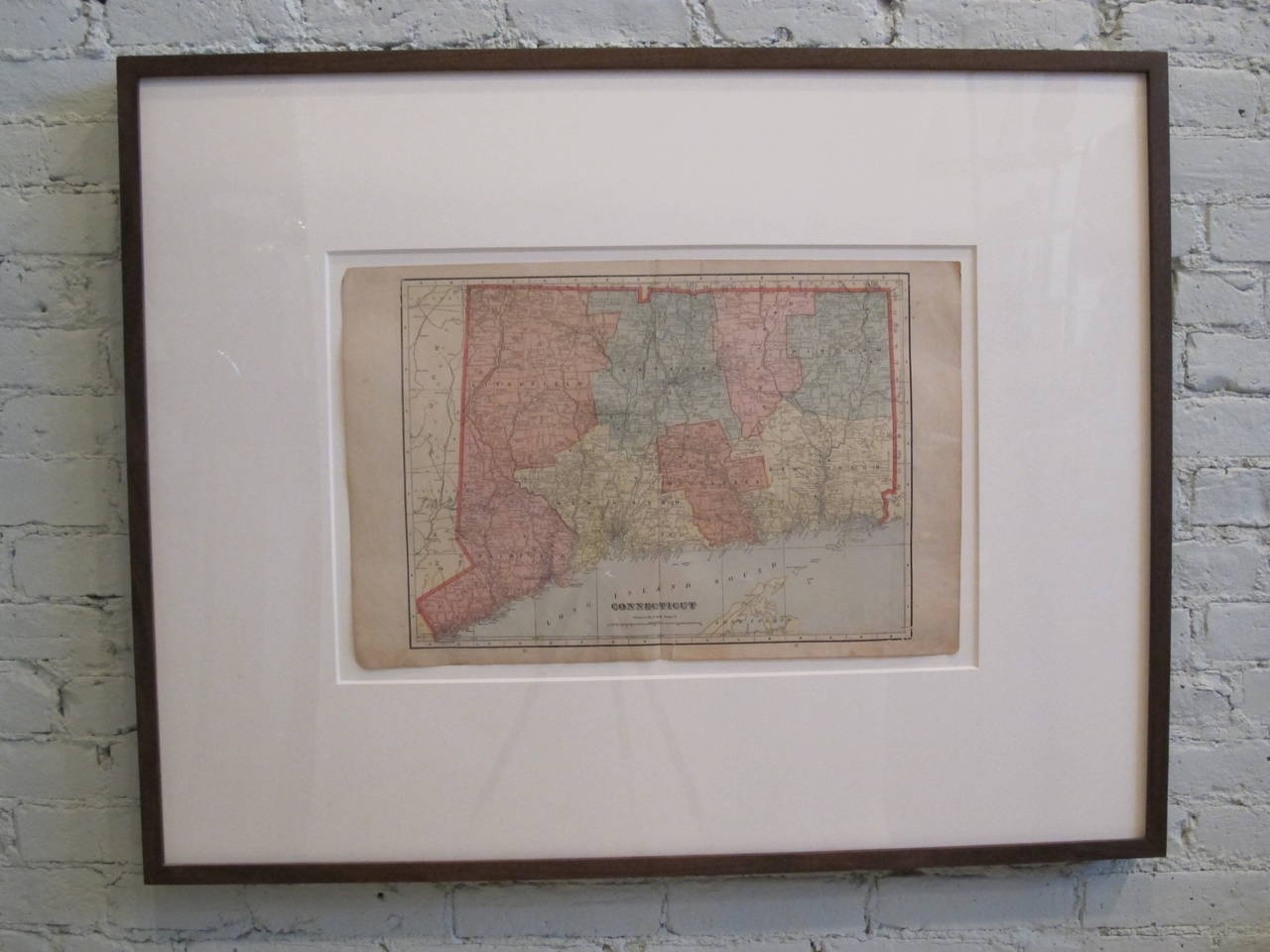 Antique map newly-framed in black-painted wood, floating on an acid-free mat under UV protective acrylic. Dimension below are for frame; actual map measures 22