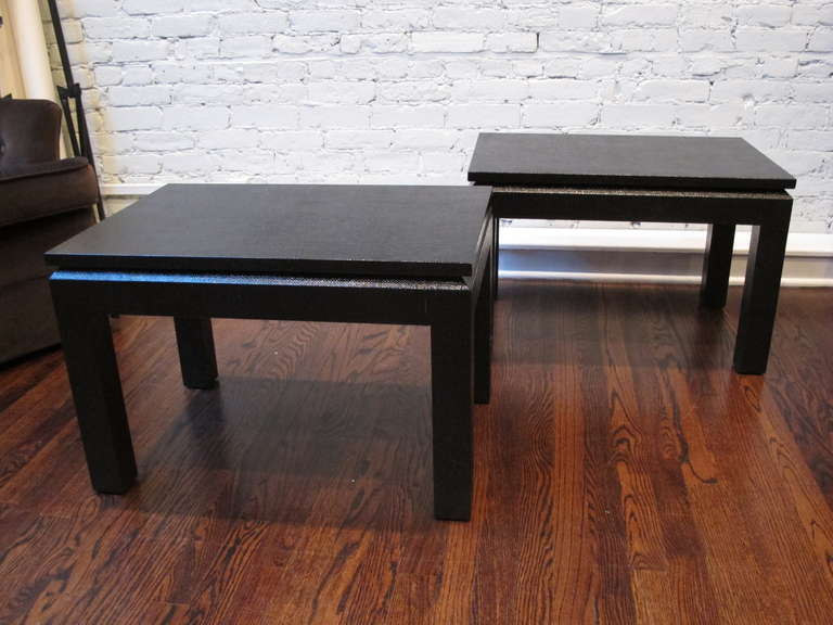 Pair of black end tables in lacquered linen. Extremely well-made and in excellent condition. The price is for the pair.