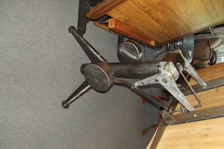 A mid 20th century French drafting table.  The table has been completely restored with all the metal being polished and lacquered and the top sanded and finished.  The table has an unusual mechanism to which allow easy universal adjustment of the