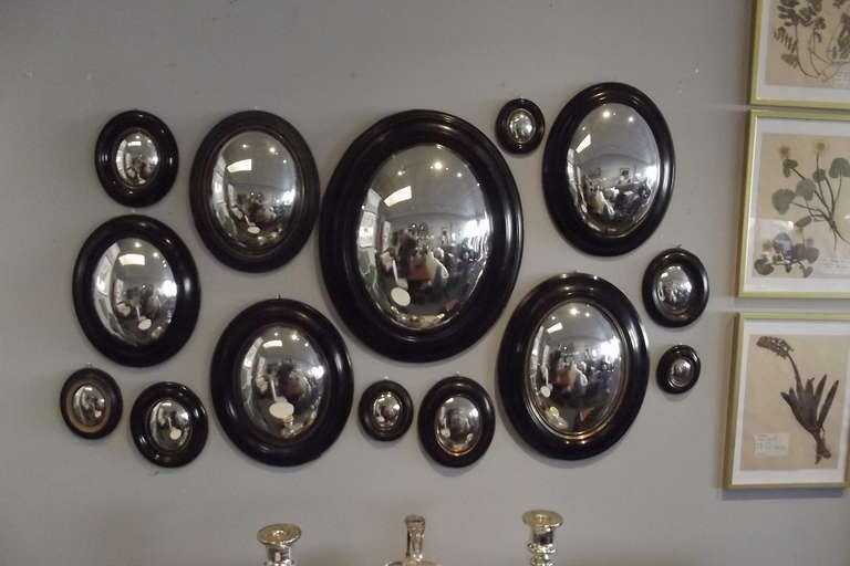 An exceptional set of fourteen Napoleon III convex mirrors in a wide range of sizes ranging from 21.5