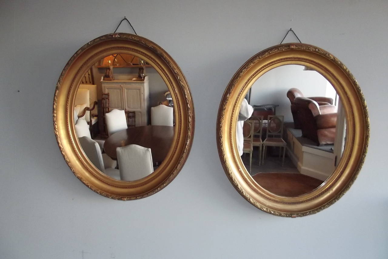 Pair of Louis XVI Style Oval Mirrors