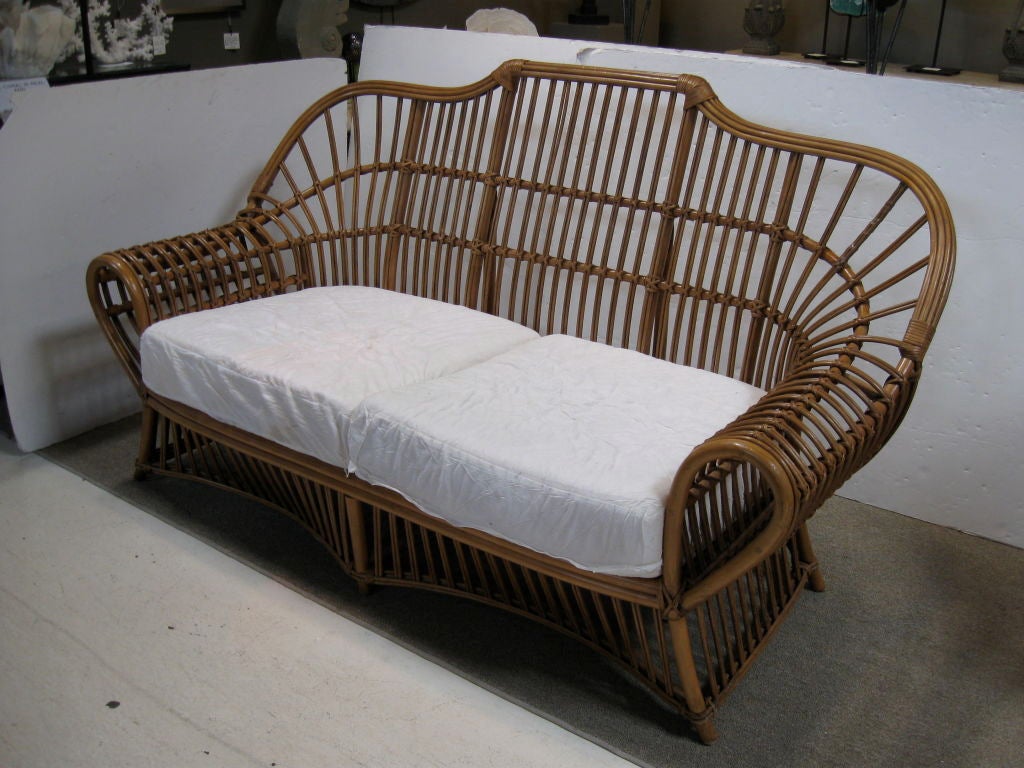 Wonderful example of natural split reed loveseat, by Ficks-Reed.  Curved arms and scalloped bottom enhance graceful design.  There are two seat cushions ready to be upholstered.  Back cushions are recommended..