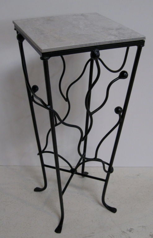Set of three wrought iron pedestals of varying heights.  Tops are removable ceramic tiles that are secured with velcro to prevent slippage.  Heights vary from <br />
30 1/2 - 38 1/2 -46 1/4<br />
Height listed below is for the tallest of the three.