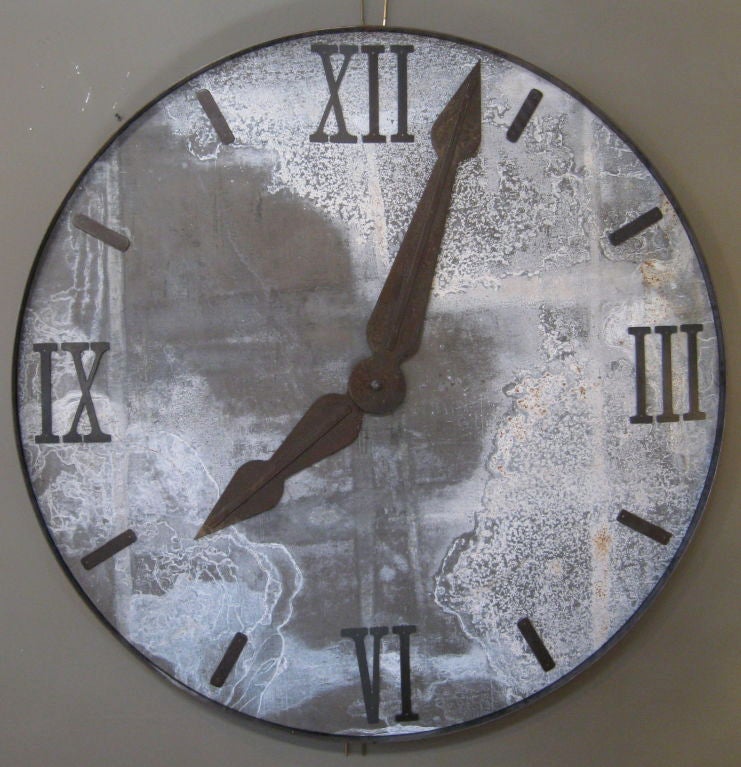 Large, dramatic clock face fabricated from weathered, salvaged zinc, with iron banding, numerals and hands.  Wonderful patina.