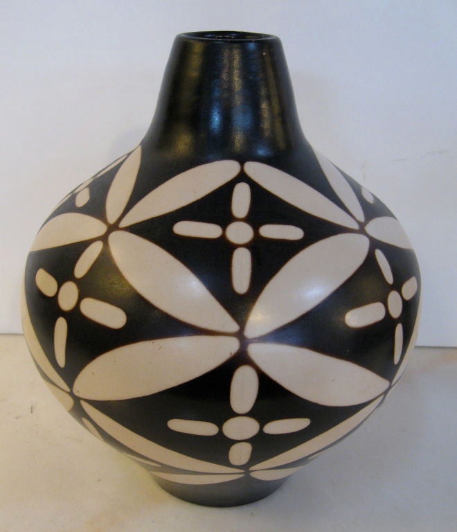 Two lovely examples of Santodio pottery from Peru.  Signature appears on only one vase.
Dimensions of the shorter vase are: h11 x dia.8 1/2 in.