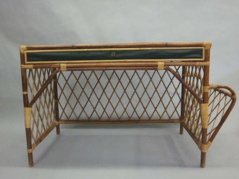 Stunning French Mid-Century Desk Attributed to Jean Royere Fusing Elements of a Modern Neo-classicism with Originality and Fantasy. 

The piece is in Rattan and designed with a Neo-classical X frame pattern typical of Royere with side panels and