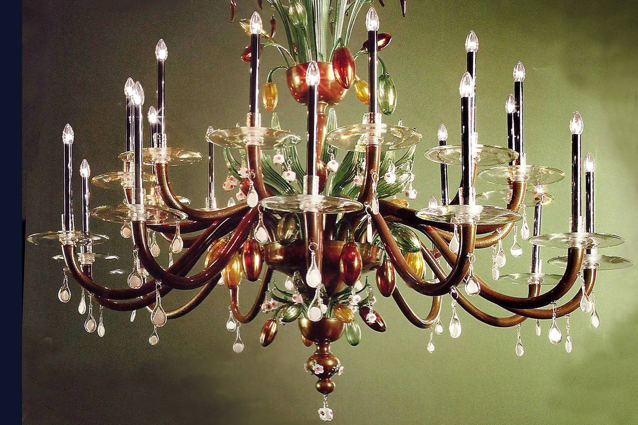 Large, stunning, romantic hand blown chocolate colored Italian Mid-Century Modern style Venetian glass chandelier with details in gold leaf, red, white, green, melon, yellow, ruby and clear glass. The structure is painted in black. 24 arms.

This