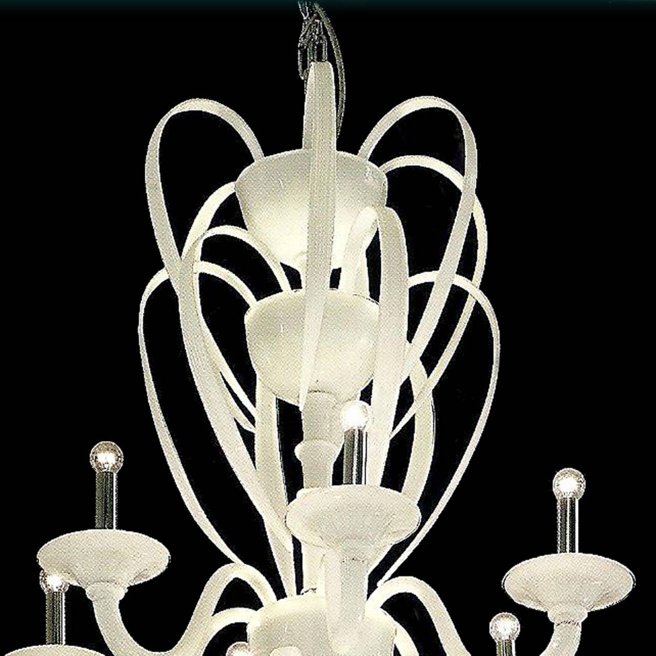 An elegant and stunning multi-tier Venetian glass chandelier in 'Lattimo' glass. This handblown Italian Mid-Century style piece reflects a modern neoclassical sensibility with its grand size, sculptural form and pure white spiritual elegance.

The