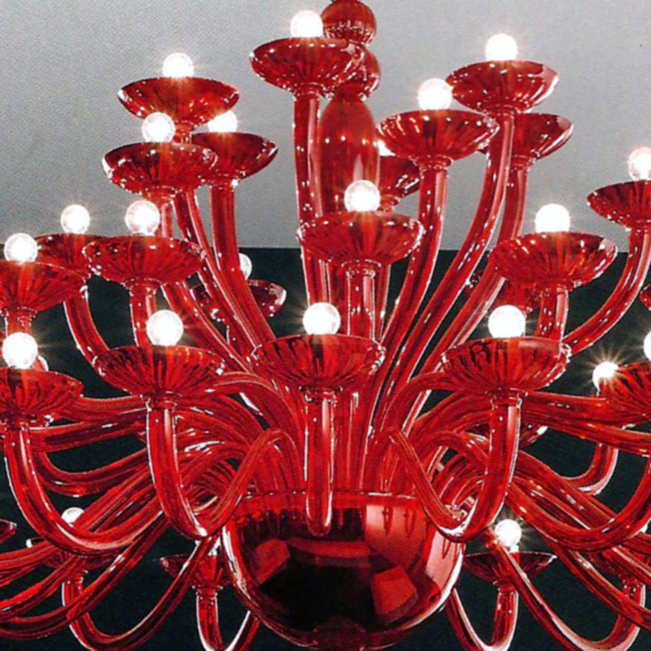 2 elegant and stunning large Venetian chandeliers or pendants in red glass in the modern neoclassical spirit, each having four tiers with 18 arms on the lower level, 12 arms on the second tier and six arms on each the third and fourth