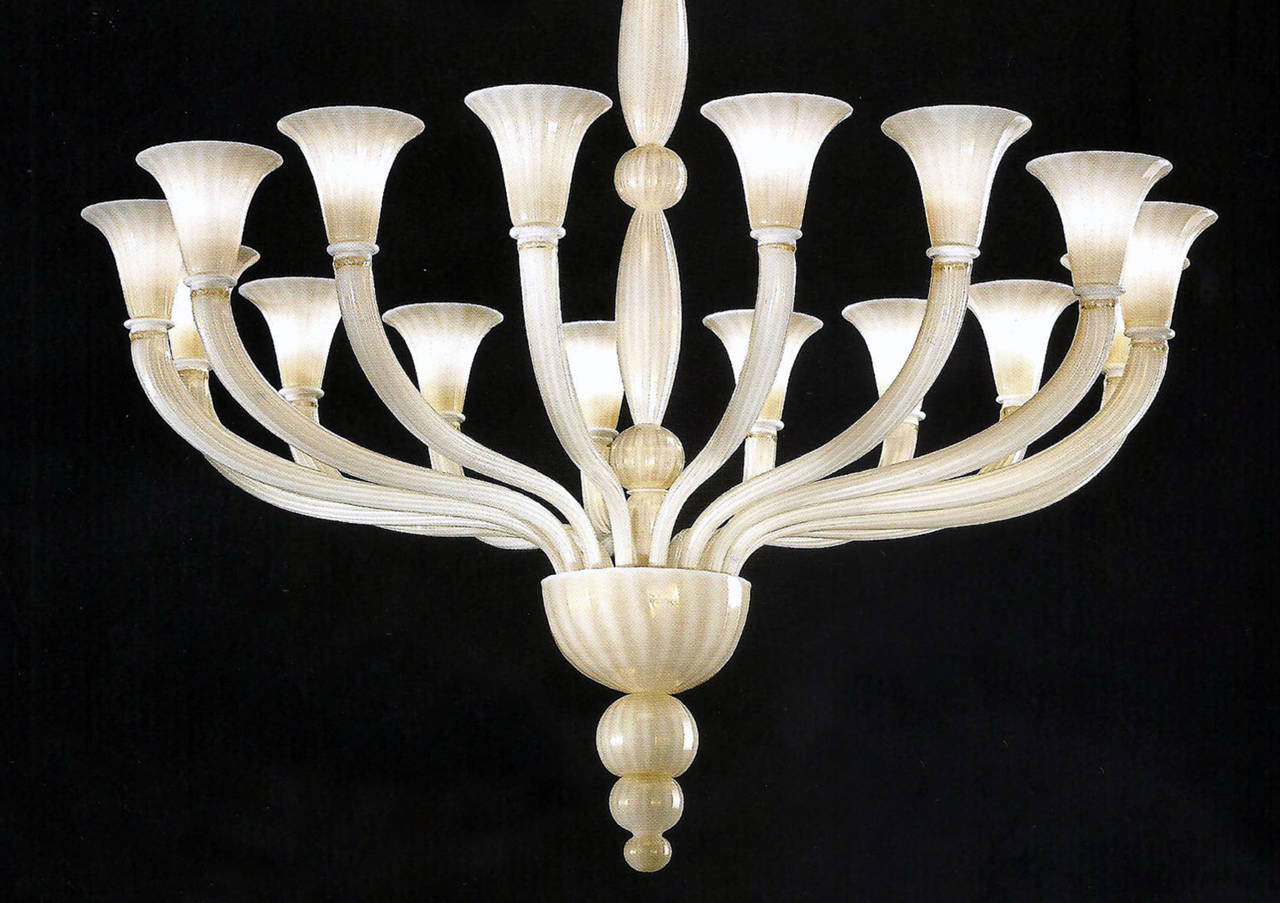 Large elegant sixteen-arm white and gold Italian Venetian / Murano glass chandelier in the Mid-Century Modern Neoclassical style. The piece is the epitome of understated style and taste. It is balanced, symmetrical and harmonious. The coloration is