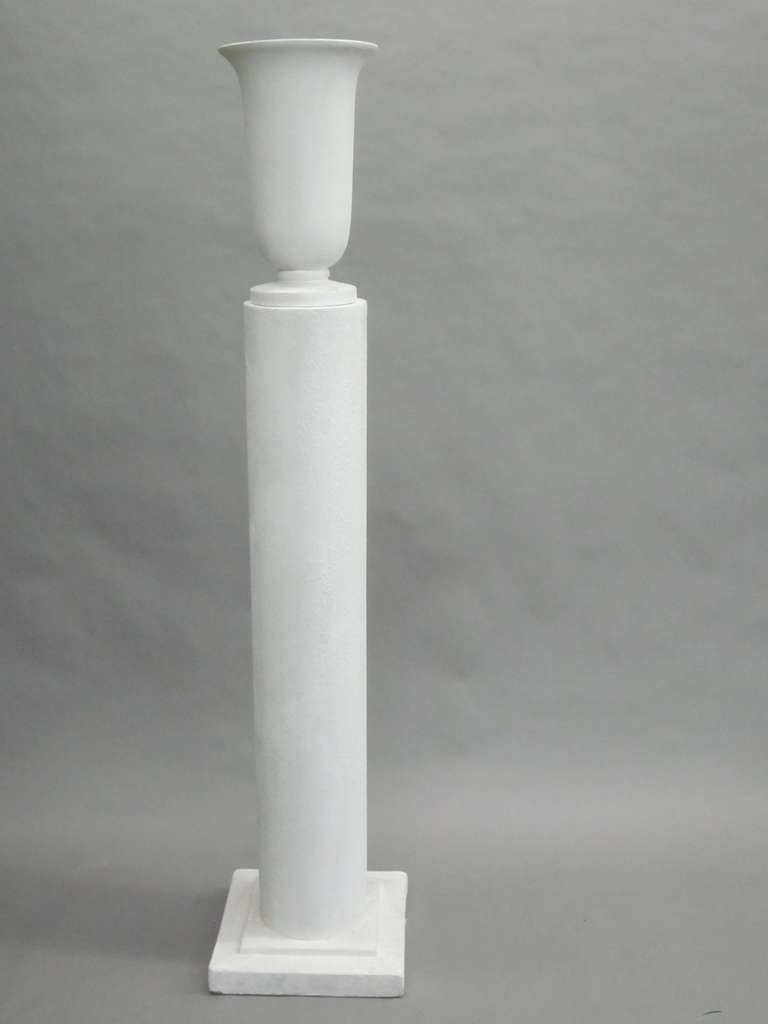 Two pairs of French Art Deco plaster columnar standing lamps in a sober, pure, clean modern neoclassical style typical of the French Aesthetic during the late Art Deco 1930 period. These sculptural objects show a perfect balance of line, form and