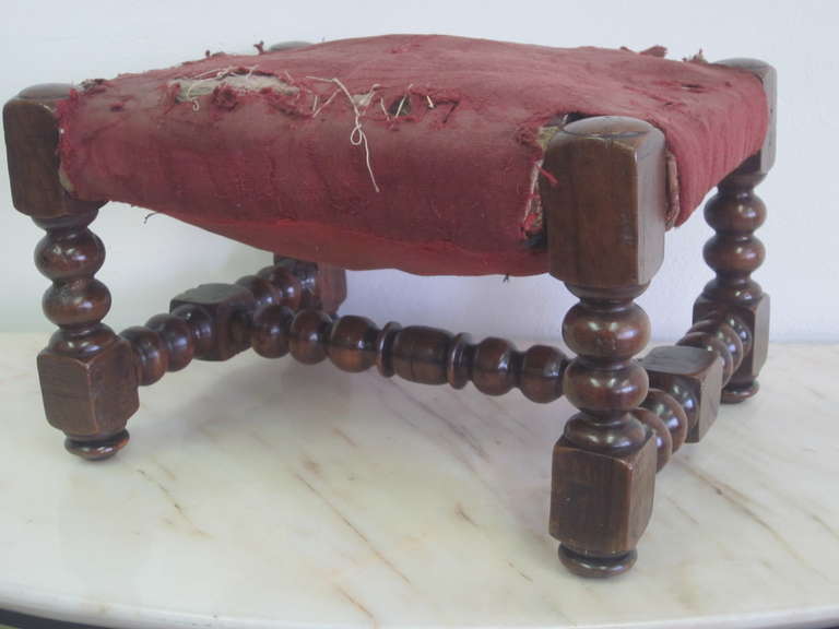 Four small hand-carved Italian footstools/ottomans/stools featuring stacked ball and baluster decoration. 

Need to be re-upholstered. Priced and sold individually.