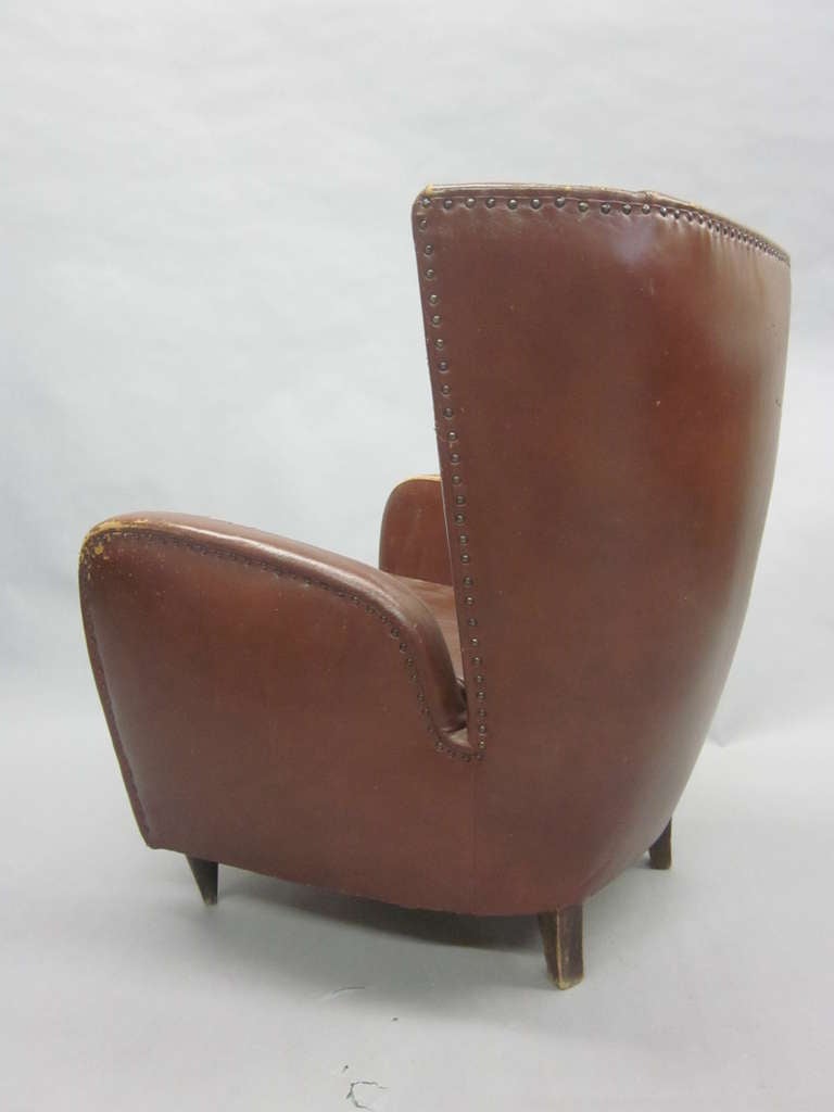 Elegant pair of Italian Mid-Century club chairs / armchairs in faux leather attributed to Paolo Buffa. The pieces embrace late Art Deco and the emerging modern movement with their simplicity and clean organic lines. 

Re-upholstery is needed.