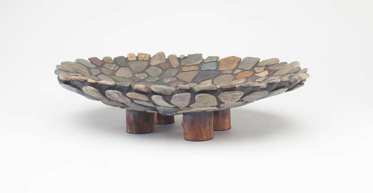 A stunning stone platter or bowl by Don Moss.

Moss creates pieces with the intent to “bring the wild energy of nature into our living space to be a remembrance and meditation on our personal connection to the wilderness”. His ceramic structures