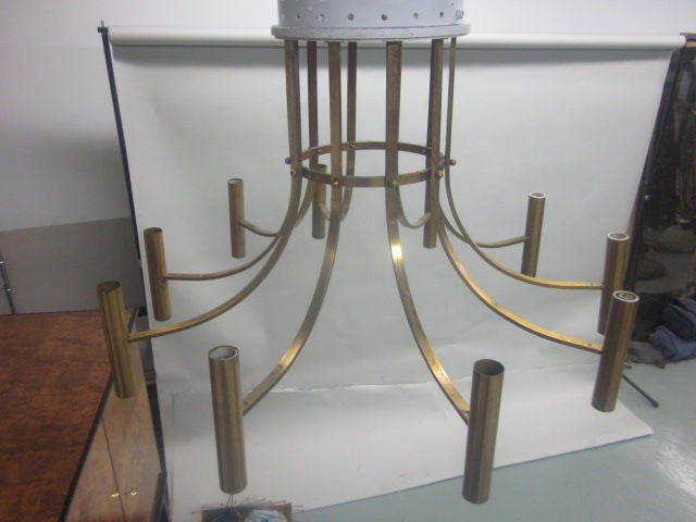 Large dramatic, yet sober Italian midcentury ten-arm brass chandelier that will flush mount to the ceiling or suspend.