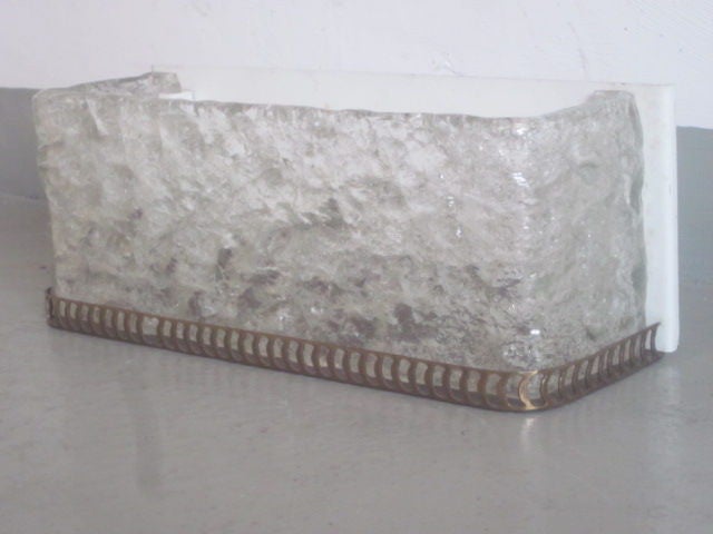 Pair of Mid-Century Modern handblown Venetian glass sconces in an ice glass pattern resting in rectangular brass frames.