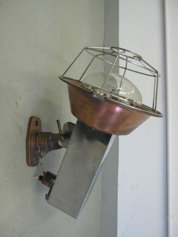 Pair of French Mid-Century Modern adjustable Marine Industrial wall lights or flush mount ceiling fixtures in the style of Jean Prouve. 

The pieces are composed of copper and nickel, articulate and can focus up or down and work on wall or ceiling.