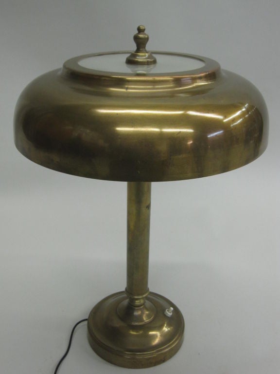 Elegant French modern neoclassical desk lamp in the manner of Andre Arbus in brass with shade partially in satinized glass.