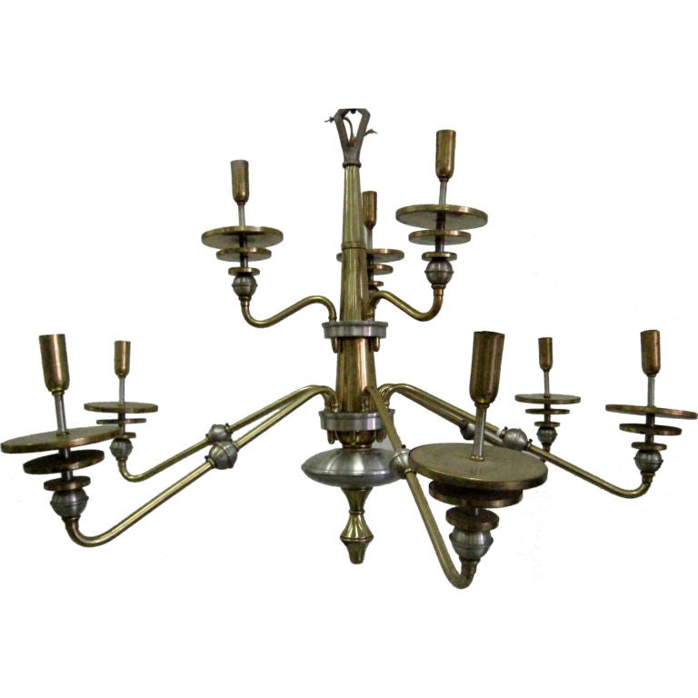 Original Italian Mid-Century Modern double tier chandelier in brass and nickeled metal with six lower arms and three upper arms. Each arm terminates with three stunning discs leading to the socket. Height without chain is 31".