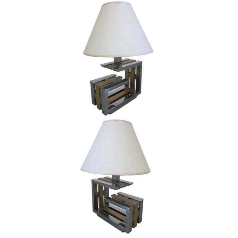 Pair of Italian Mid-Century Modern table lamps in a geometric calligraphy form composed of nickel and brass by Romeo Rega.

Shades are for demonstration purposes only.