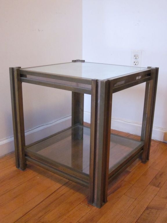 Elegant Italian Mid-Century Modern Double Level brass and nickel table by Romeo Rega for use as side table or nightstand. Mirrored top with glass lower level.