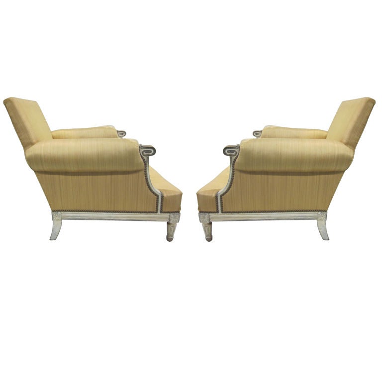 An elegant pair of Mid-Century Modern Neoclassical lounge chairs, armchairs or bergere in the style of Louis XVI by Maison Jansen. 

The armchairs are of the highest quality design and manufacture featuring a striking form and profile, perfect