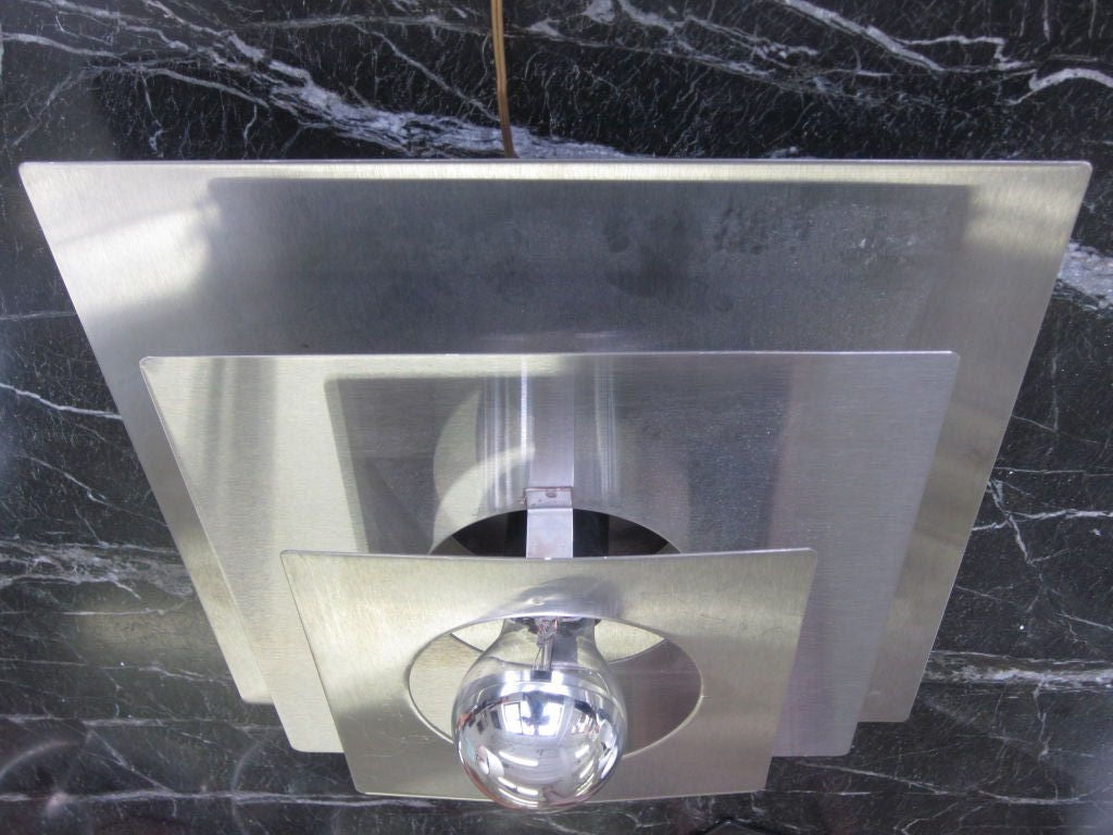 2 French 70's Aluminum Reflector Fixtures / Sconces by Francois Monnet