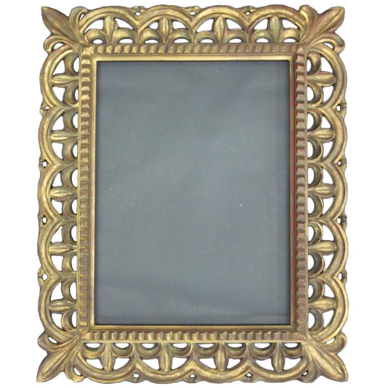 A French Rectangular Hand Carved giltwood wall mirror / frame in the form fleur-de-lys.

Shown without mirror.