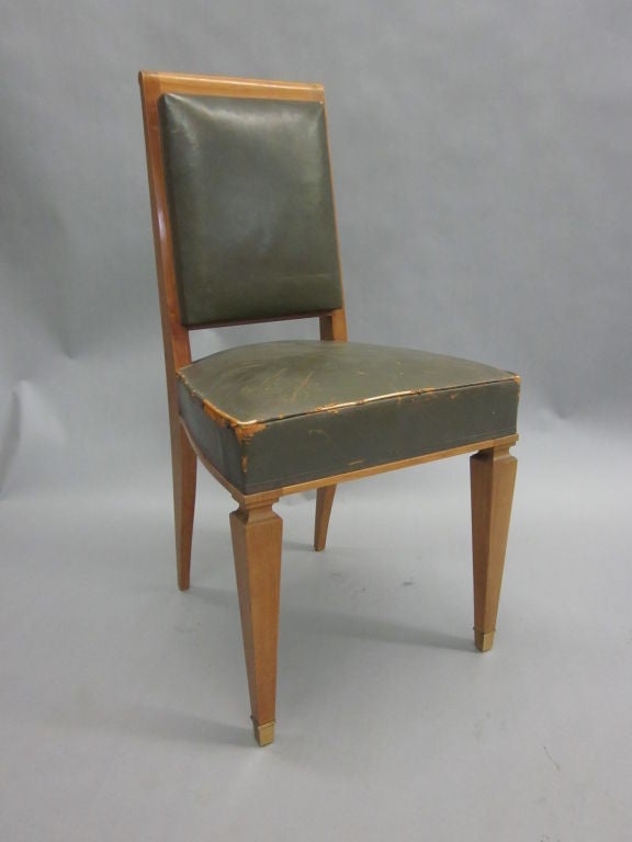 8 Elegant Cherry Dining Chairs of the Highest Quality Attributed to Andre Arbus with Noble, Sober Lines and Delicately Tapered Legs ending in Gilt Bronze Sabots. Seat height is 18