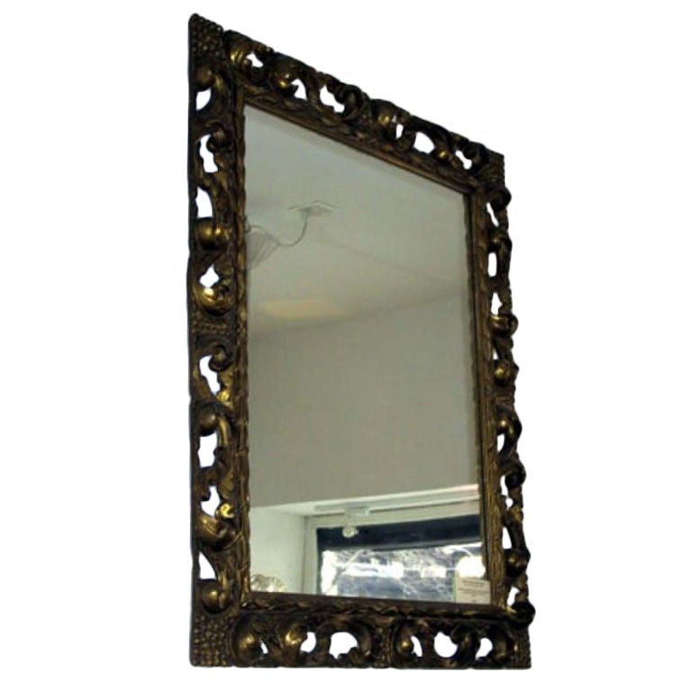 Miroir italien en bois doré sculpté