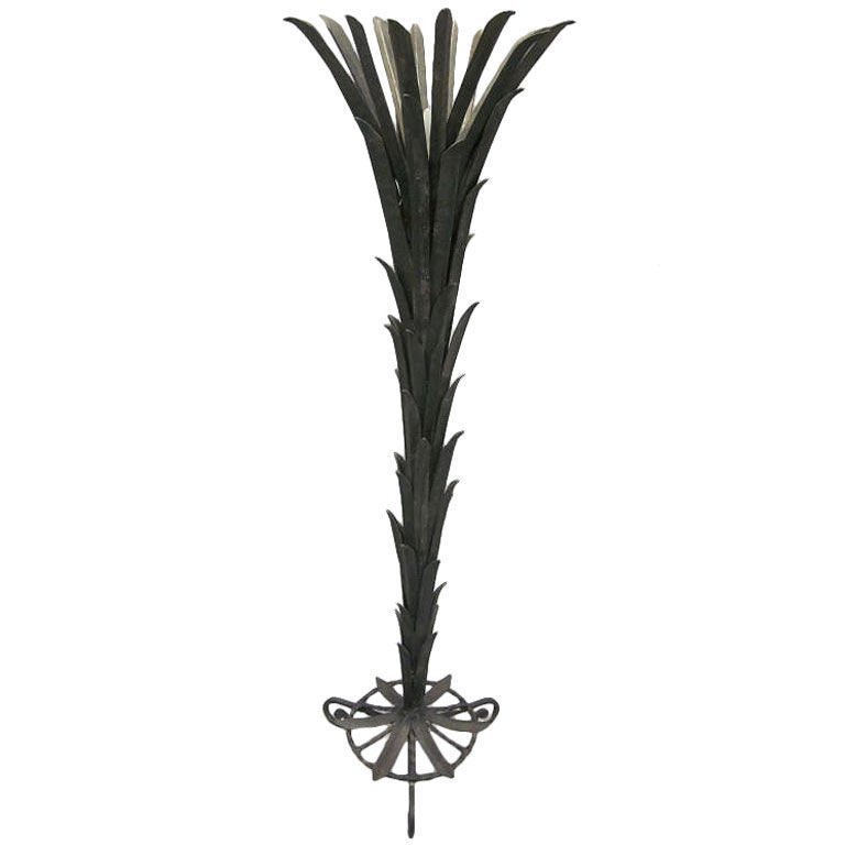Elegant French Art Deco wrought iron standing lamp in the form of palm fronds by French Master Ironworker, Edgar Brandt.

Literature: See Edgar Brandt, master of Art Deco ironwork by Joan Kahr.