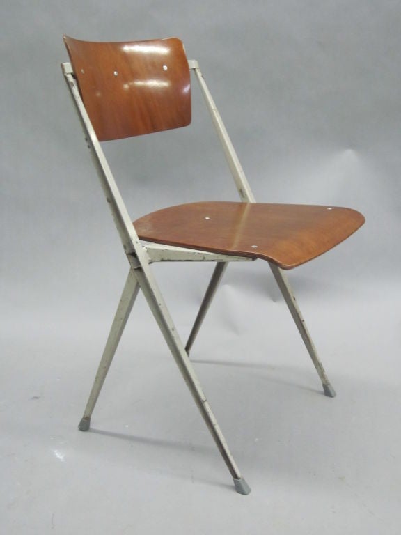 Two Dutch Mid-Century Modern desk or side chairs in enameled steel and wood by the architect son of the early Dutch modernist master, Gerritt Thomas Rietveld.