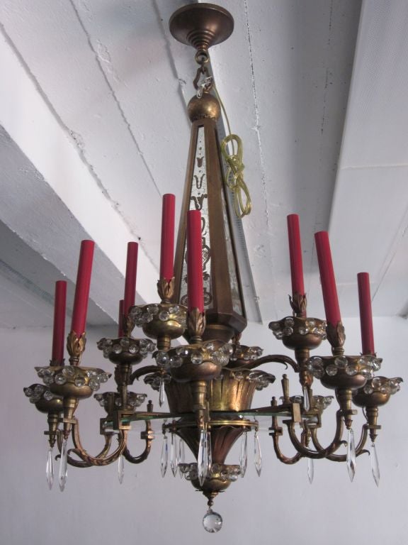 A Rare and Important French Mid-Century Modern / Art Deco chandelier by the legendary French maker of lighting and mirrors, Maison Baguès and retailed in Paris by Maison Jansen. The chandelier is an icon of the 1925 French Art Deco period and has an