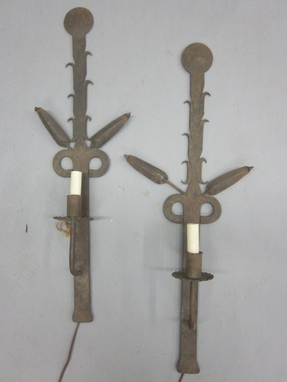 Pair of Large French Art Deco wall lights in wrought iron featuring the stylized form of the hops plant.