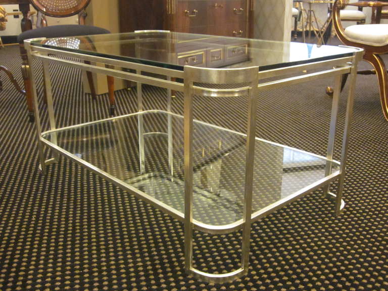 Elegant Italian, Mid-Century style, silver leafed double level cocktail table embracing neoclassical and modern traditions.

Timeless, modern and practical. 