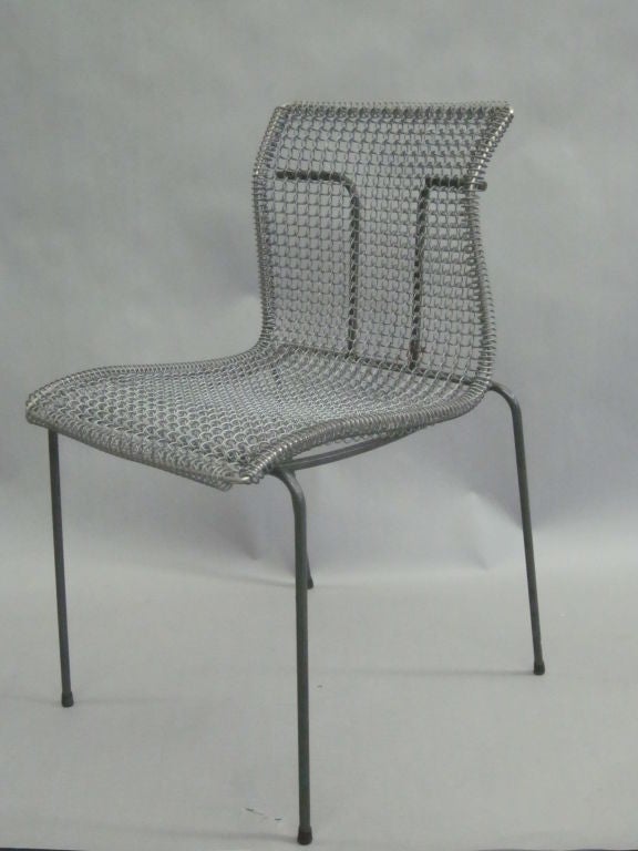 Original pre-production prototype of a wire mesh metal desk chair by Niall O'Flynn shown at the New York Furniture Fair in 1994 and later produced by t' Spectrum.

Composed of an Enameled metal frame and a wire mesh seat.