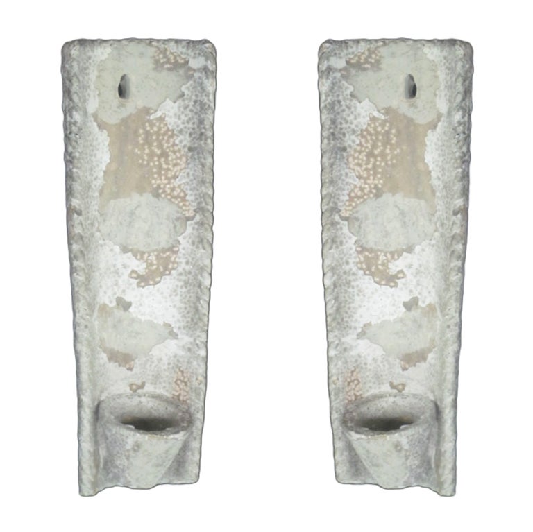 Pair of French 1940s painted terracotta wall lights in the Rustic tradition with a naturally distressed patina.

Can be wired to specification.