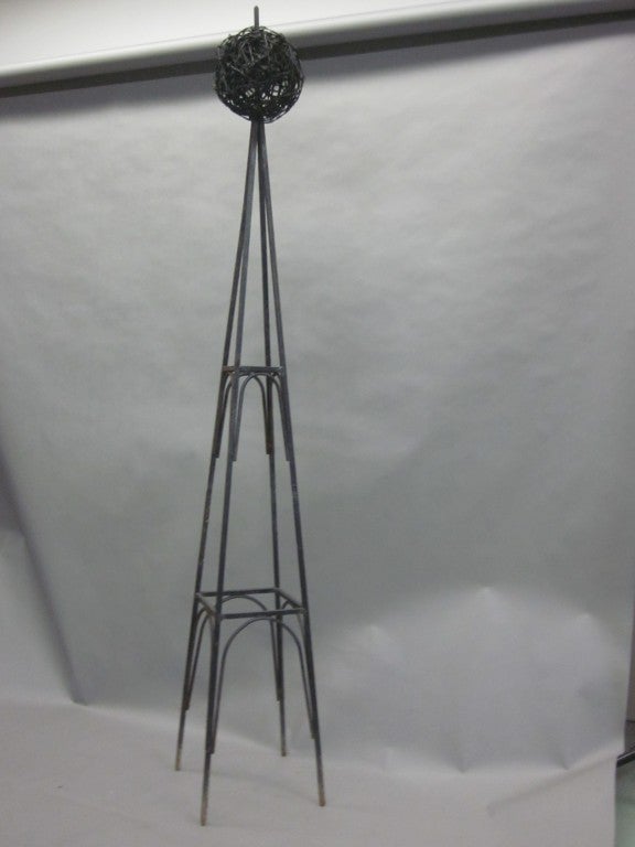 Pair of handmade wrought iron obelisks for use as decorative architectural elements or as garden ornaments/trelisses.

Can be purchased individually or as a pair.