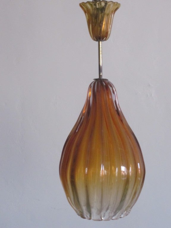 Elegant Italian Mid-Century Modern Murano glass chandelier/ ceiling fixture /  lantern with subtle variations in glass coloration with clear and amber tones. 

Height is adjustable from 20