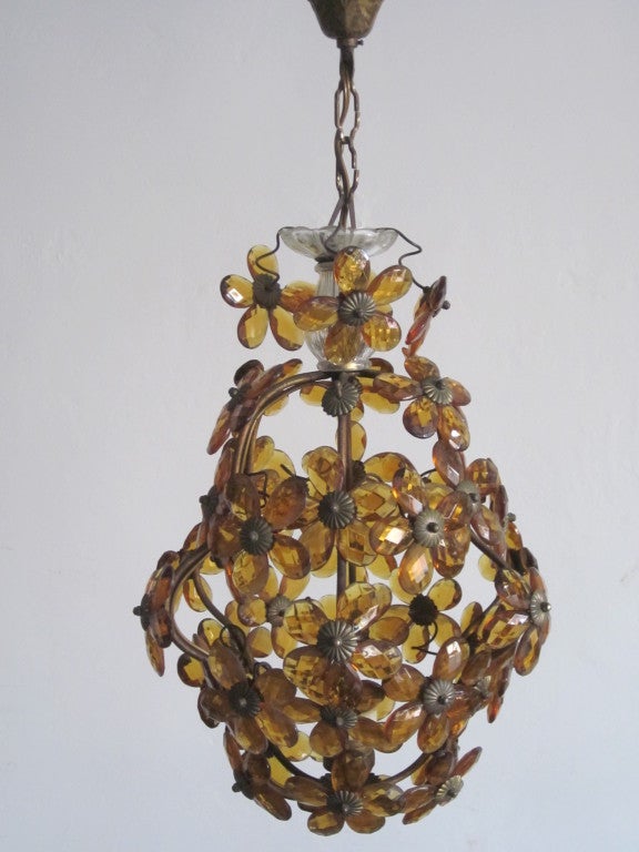 Elegant French MId-Century cut crystal amber chandelier / pendant / flush mount by Baguès in a resplendent floral pattern.

Glass alone is 16
