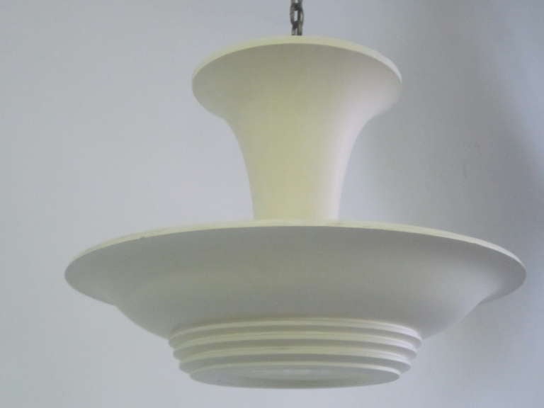 Elegant, sober French plaster chandelier, pendant or flush mount fixture attributed to Arlus, 1930. The piece has a plaster collar / stem that connects to the ceiling and central disc has a satin glass central plate to allow light to filter down.