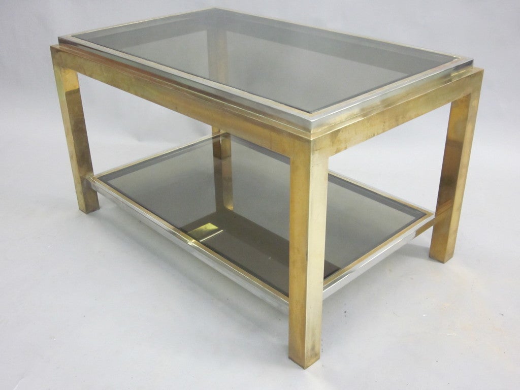 Exquisitely made Pair of French Mid-Century Modern double level side / end tables with solid brass and polished nickel framework and smoked glass tops, designed by Willy Rizzo and made for Maison Charles. 

Signed on frame. A matching Maison Charles