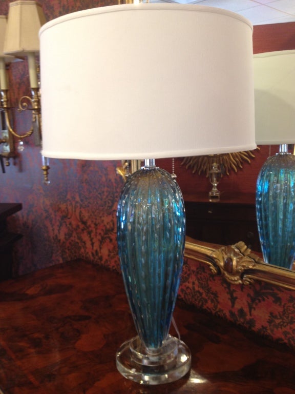 Elegant, Subtle and Quietly Stunning Hand Blown Contemporary Mid-Century Modern Style Venetian Glass Table Lamps in a Light Blue/Aqua Color Supported on Clear Glass Bases.