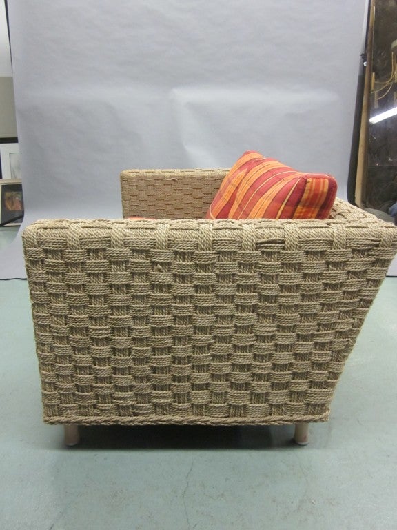 Rare woven rope settee / two-seat sofa attributed to Adrien Audoux and Frida Minet and manufactured by Ligne Roset. A Pair of Armchairs are also available at additional cost (see last 2 photos). The price below is for the sofa only. 

Cushions are