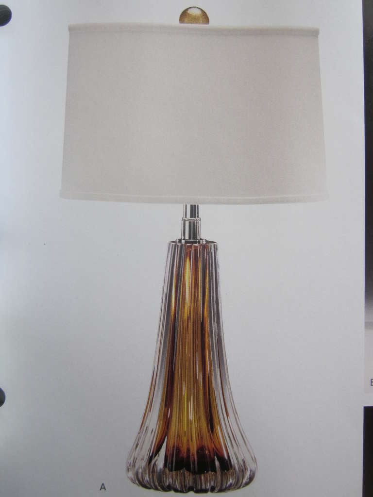 Elegant pair of handblown contemporary Mid-Century Modern style Murano glass table lamps in clear and amber glass attributed to Seguso.