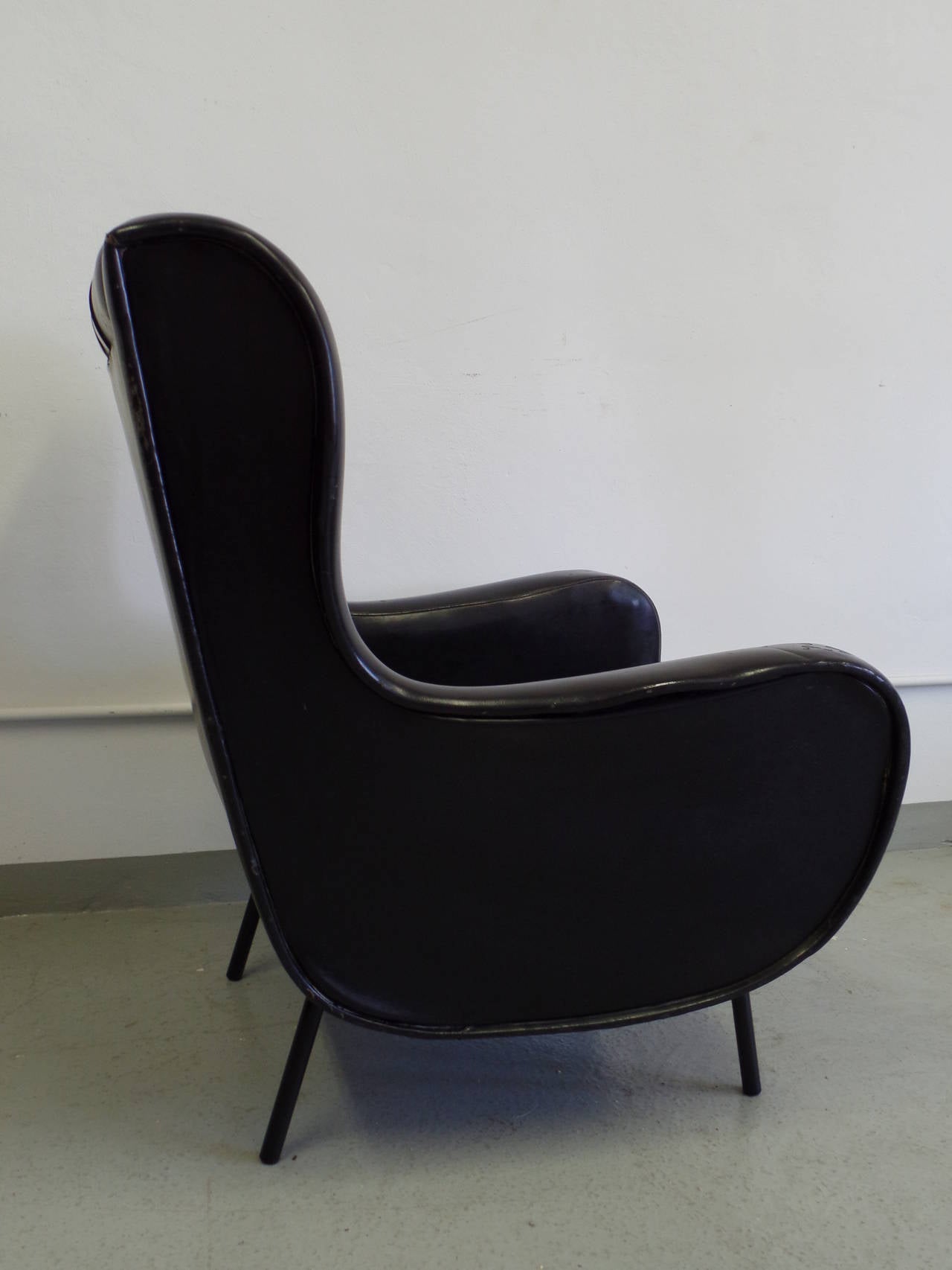 Elegant Pair of Italian 1950's Design Wingback Armchairs in the Style of Marco Zanuso's Senior Chairs Designed for Arflex. These mid-century chairs are large and comfortable, and are perfect organic modern forms to re-upholster to client taste.