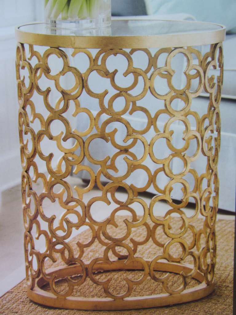 Pair of Italian Mid-Century style gilt iron end tables or nightstands with decoration in a quatrefoil pattern. These are stunning, transparent pieces with a modern spirit that maintain a connection to a Gothic past through their 