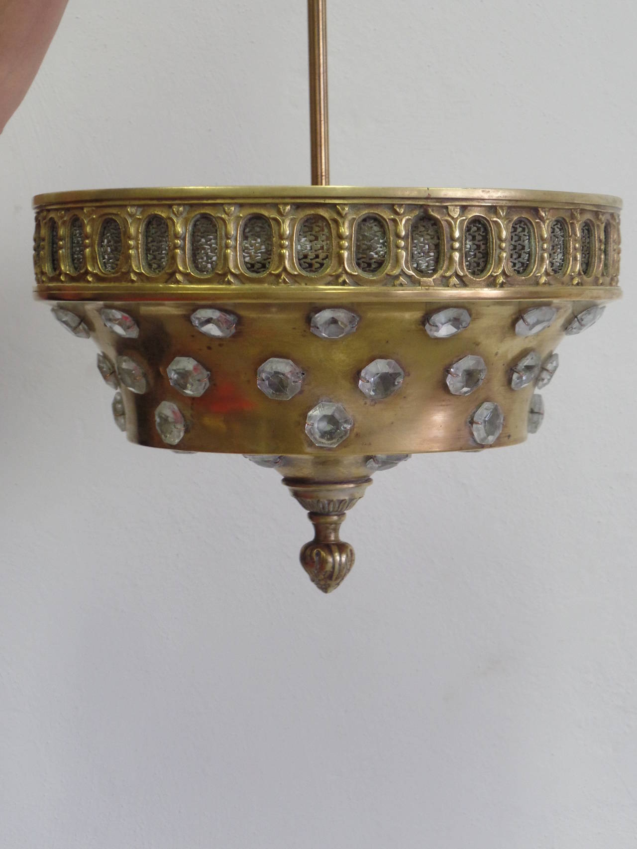Elegant French Mid-Century gilt bronze light in the Modern Neoclassical taste with imbedded cut crystal by Maison Jansen that can be hung as a pendant or as a flush mount fixture. 

Fixture alone without stem is D 12