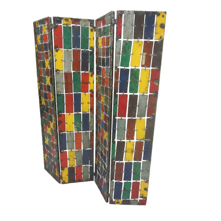 A French artist made, painted modern geometric abstraction double sided screen or room divider with four panels made from handcut, enameled pieces of metal and linked together. Designed and made by Dominique Silkin.

Both sides form geometric